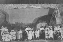 Yiddish theater performers on stage in a play. 